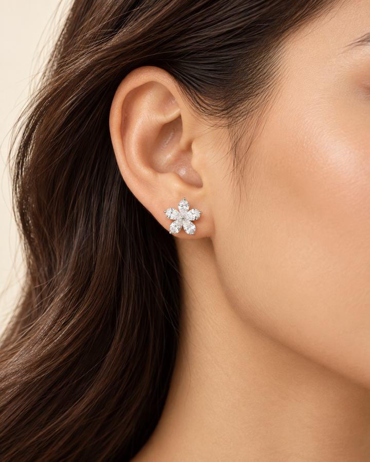 18ct white gold lab-grown pear-shape flower stud earrings on model