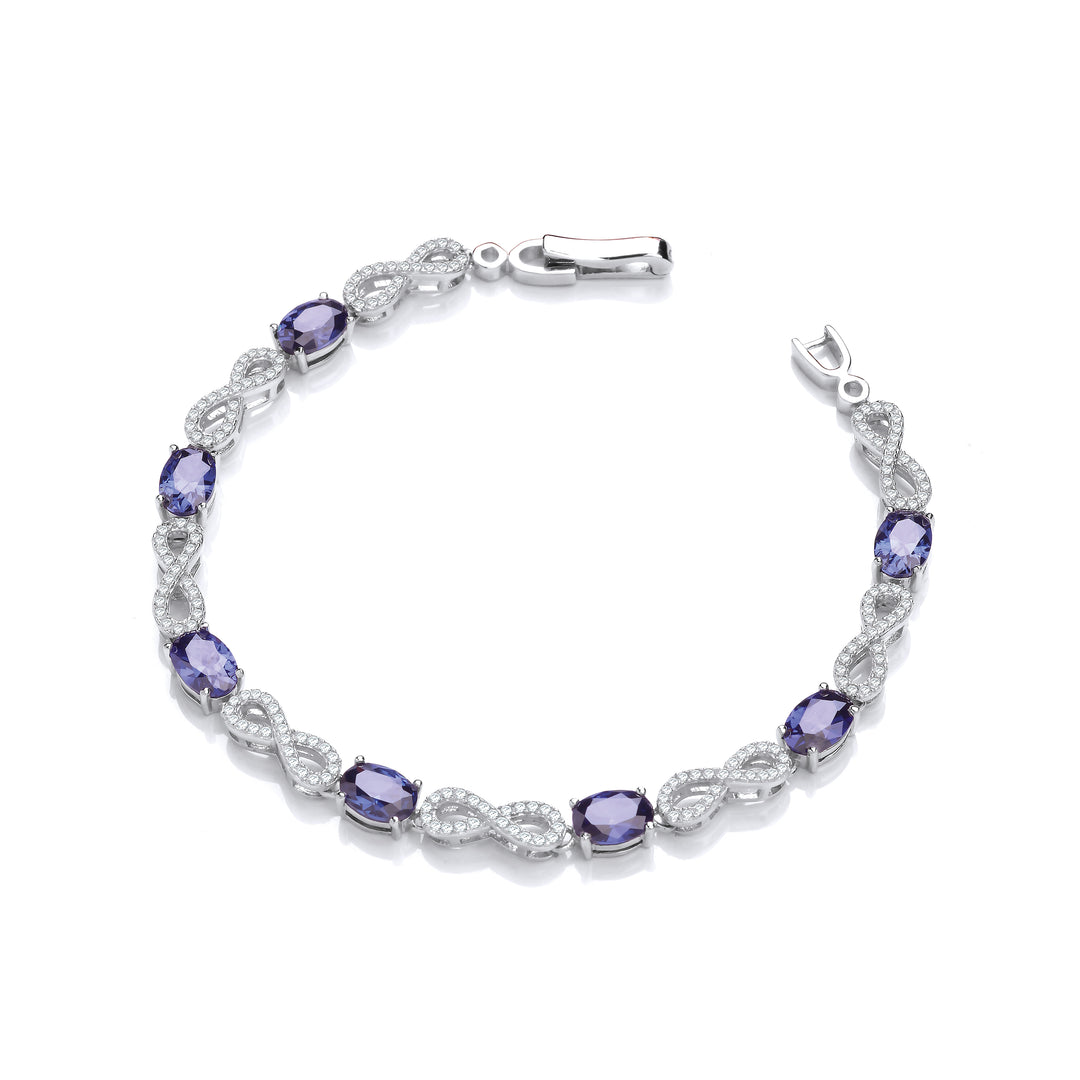 Infinity Sapphire Blue CZ Tennis Bracelet In Silver
