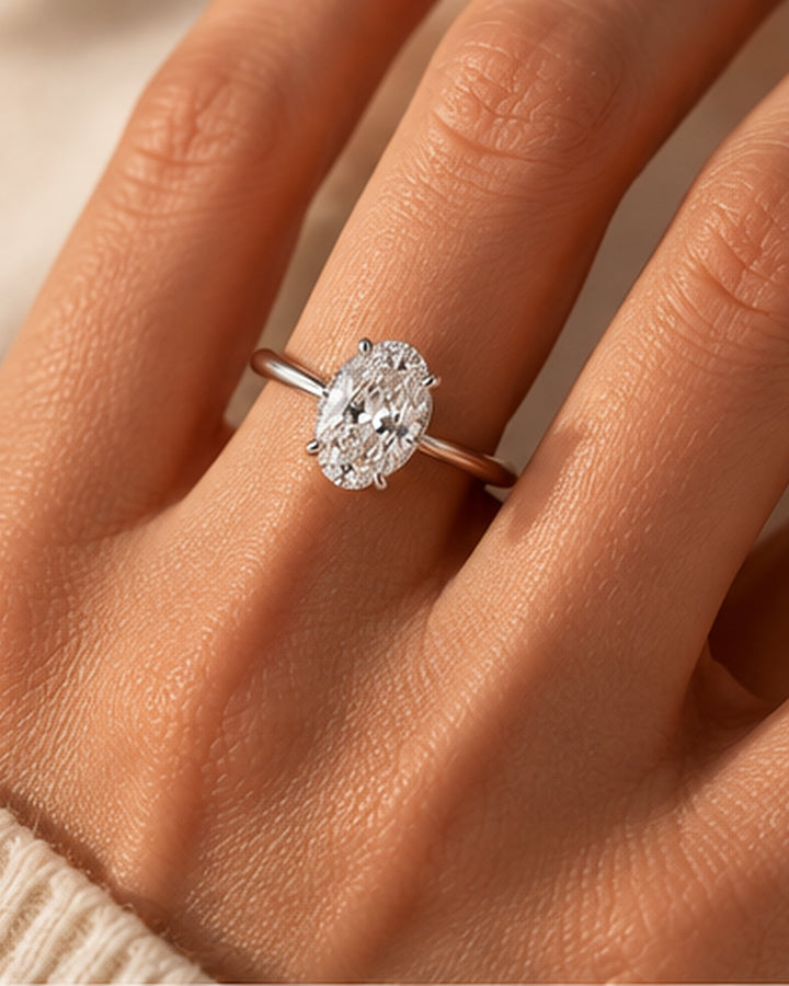 18ct White Gold 2.24ct Oval Hidden Halo Lab Grown Diamond Ring - model hand image