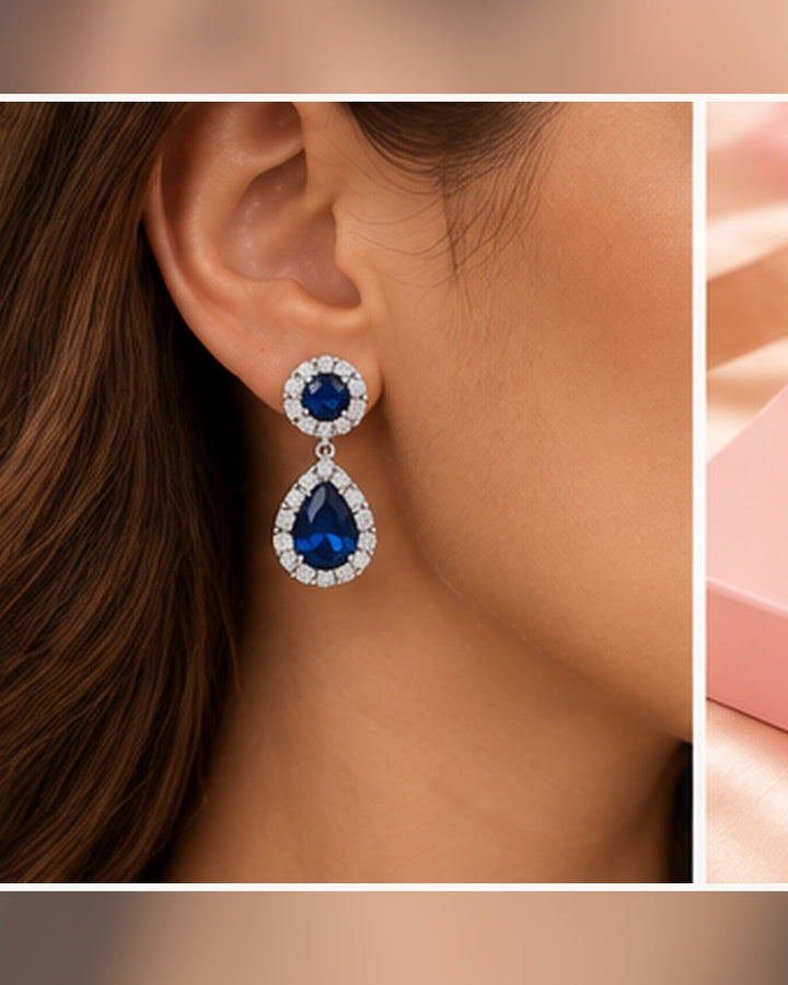 Blue halo pear drop earrings — realistic on-ear portrait image