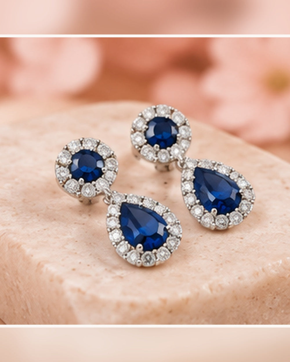 Blue halo pear drop earrings — soft styled portrait image
