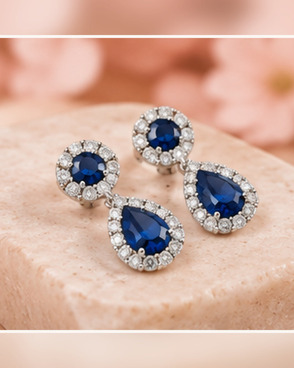 Blue halo pear drop earrings — soft styled portrait image