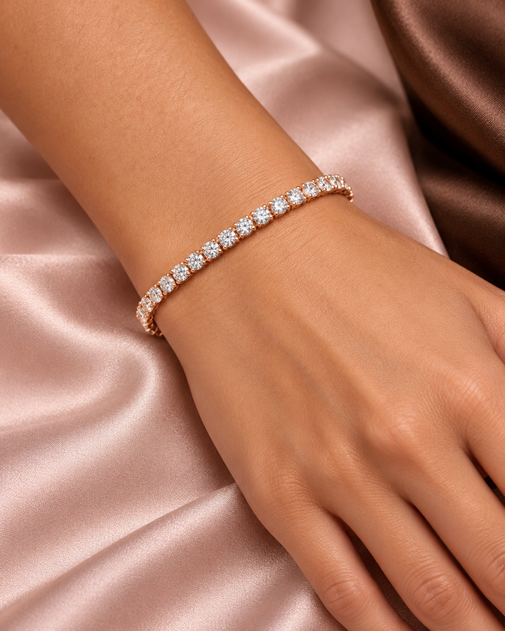 Classic rose-gold tennis bracelet worn on wrist
