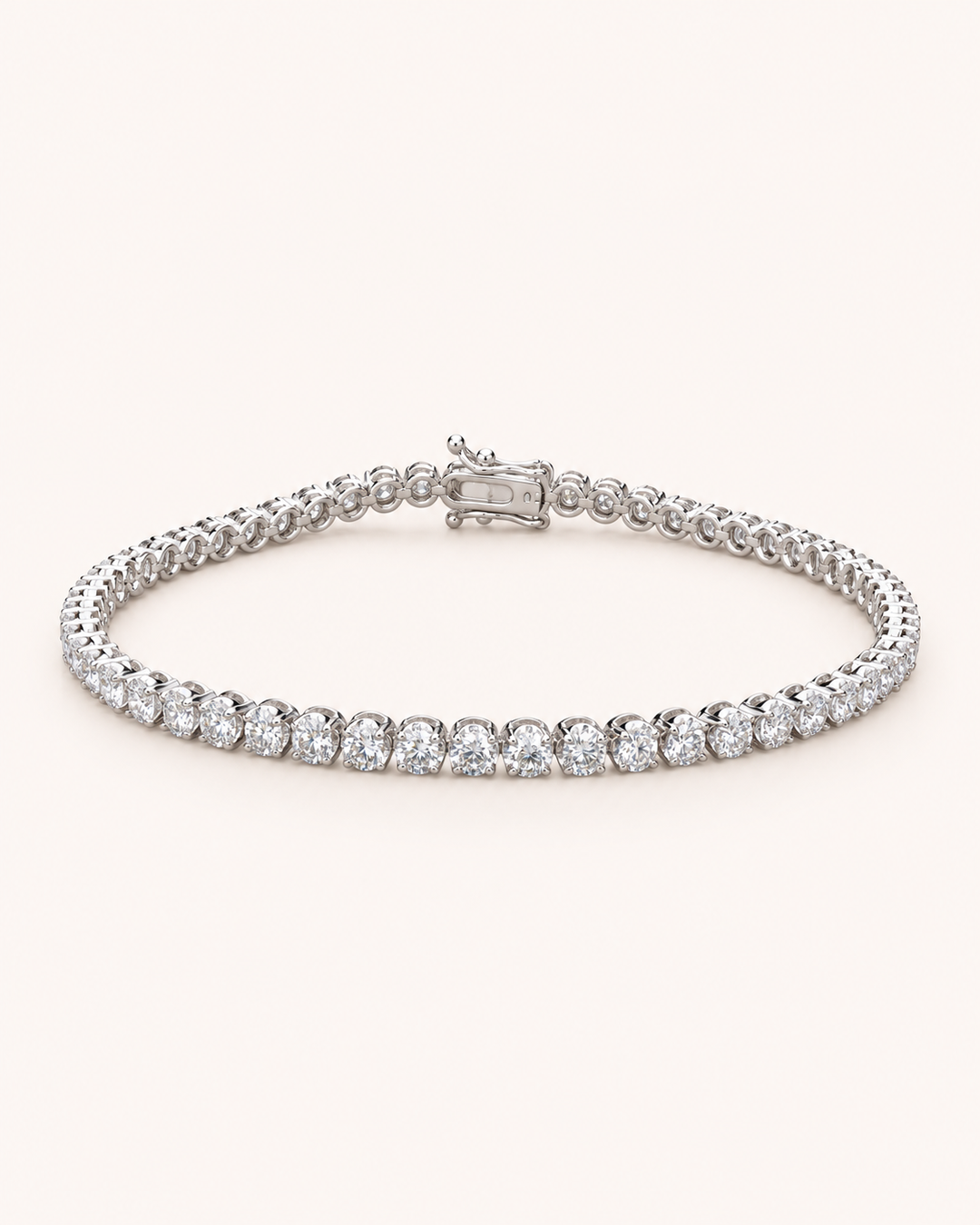 Crown-set lab-grown diamond tennis bracelet on soft ivory background