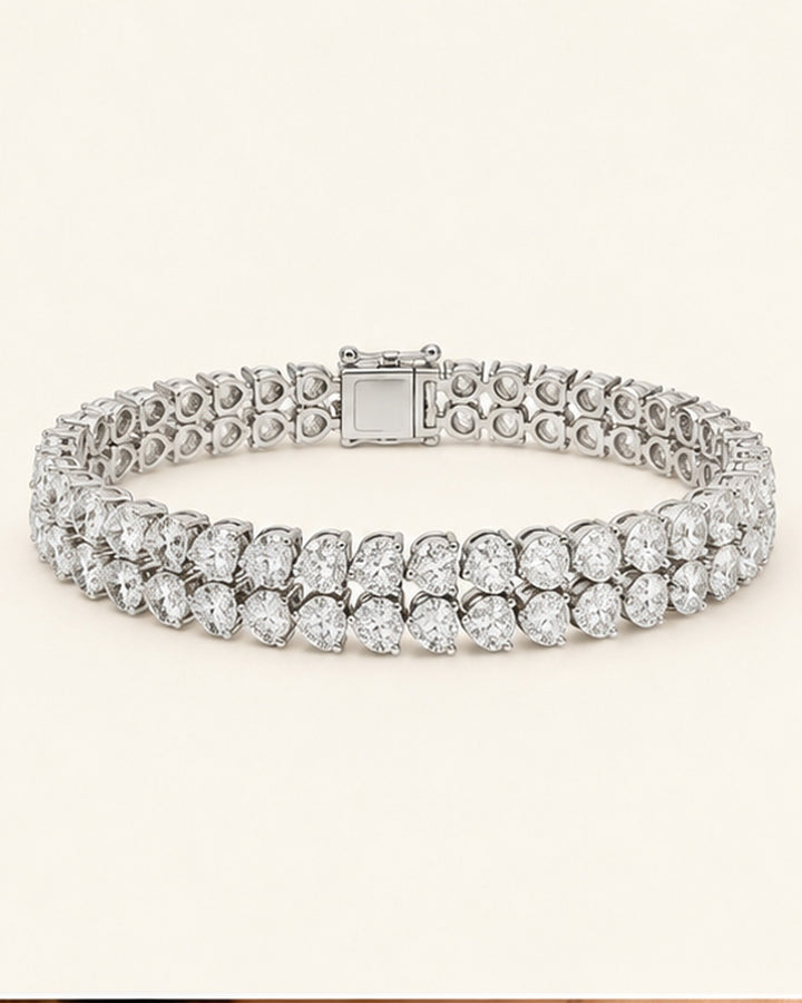 Double row pear shape lab-grown diamond tennis bracelet on cream background