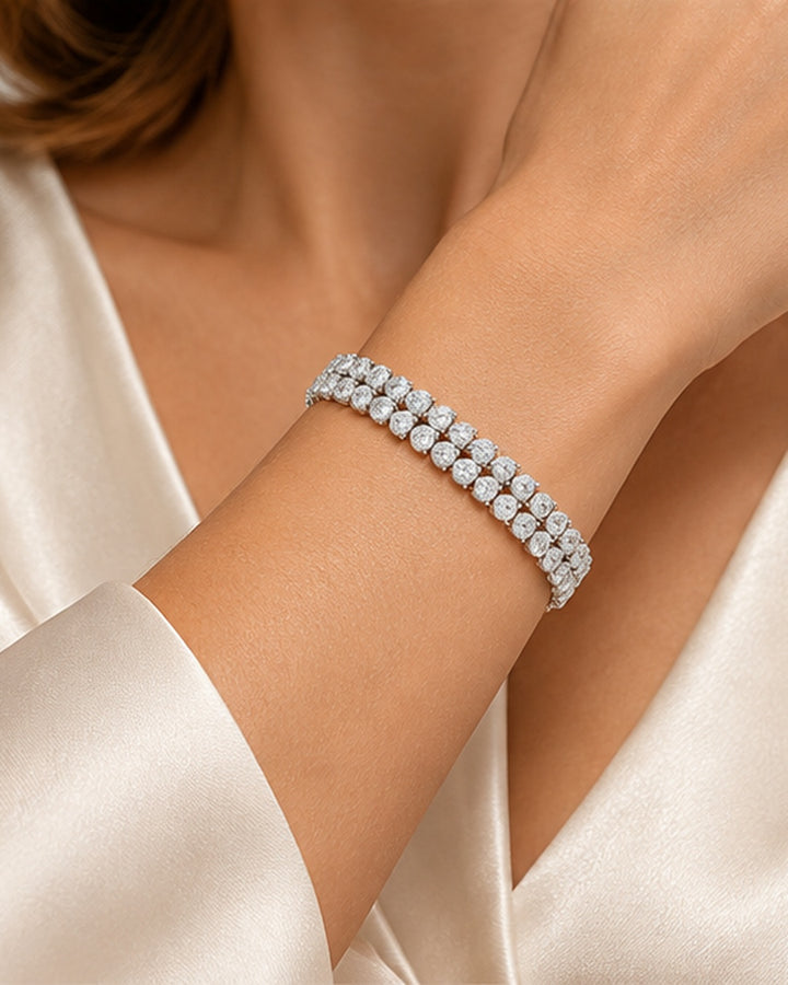 Double row pear shape lab-grown diamond tennis bracelet worn on wrist