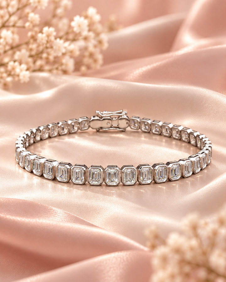 Emerald Cut Rub Over Lab-Grown Diamond Tennis Bracelet styled on blush satin