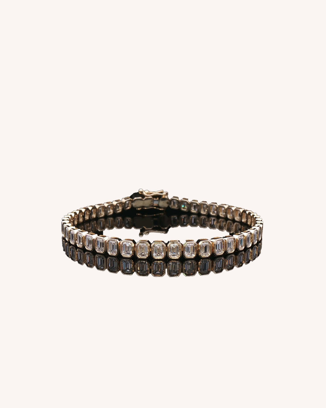 Emerald Cut Rub Over Lab-Grown Diamond Tennis Bracelet in yellow gold on GeMMs & Co. cream background