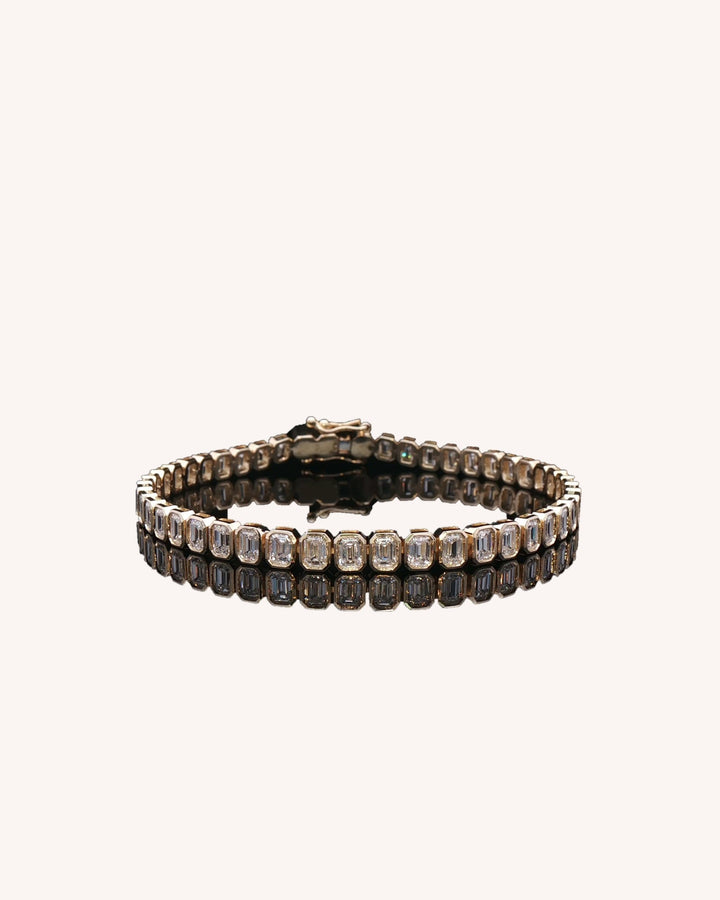 Emerald Cut Rub Over Lab-Grown Diamond Tennis Bracelet in yellow gold on GeMMs & Co. cream background