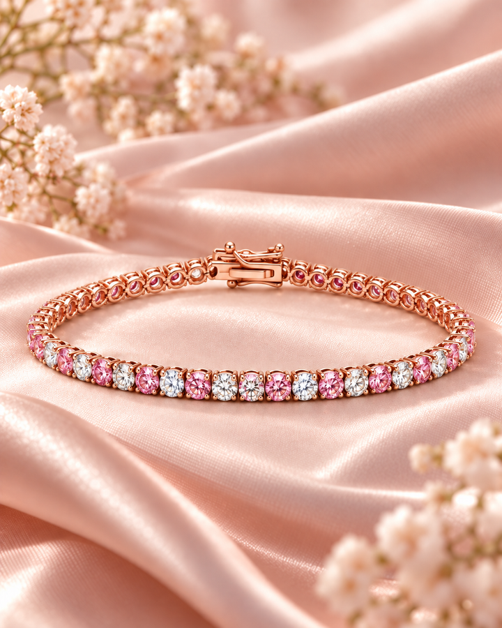 Fancy Coloured Lab-Grown Diamond Crown Tennis Bracelet in rose gold with alternating pink and white diamonds styled on blush satin