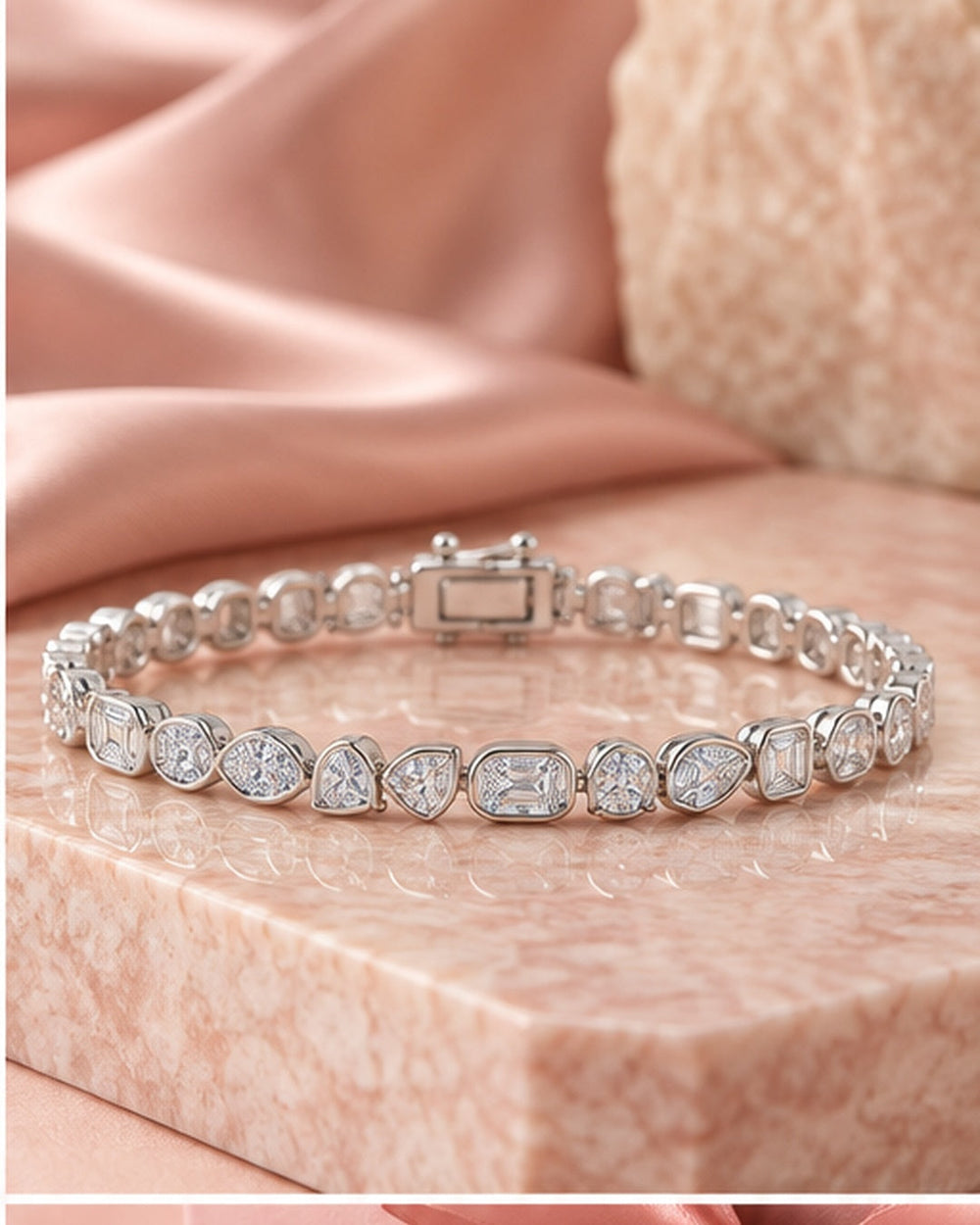 Fancy shaped rub-over lab-grown diamond tennis bracelet styled on blush satin