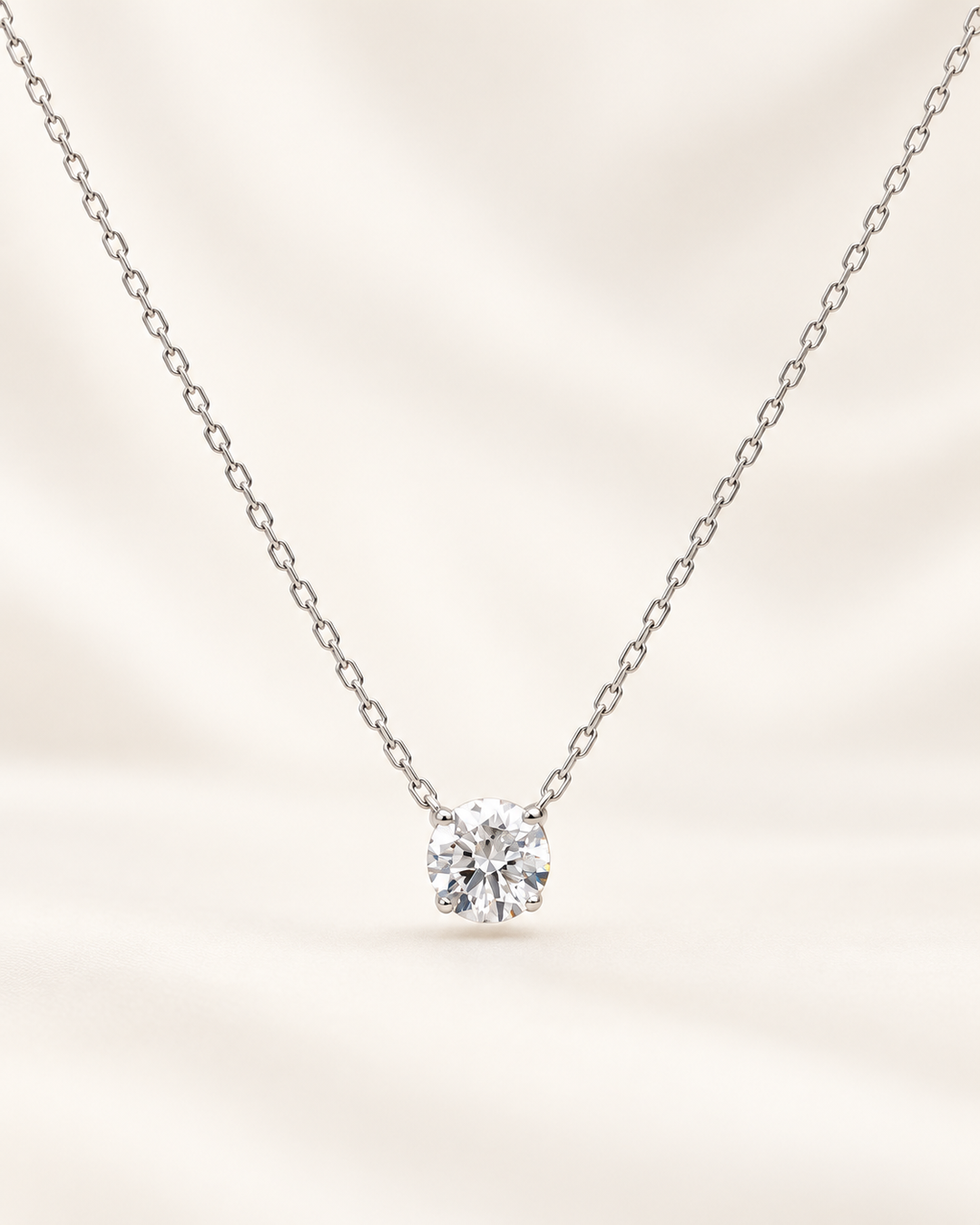Floating solitaire necklace in 9ct White Gold on cream background #metal_9ct-white-gold