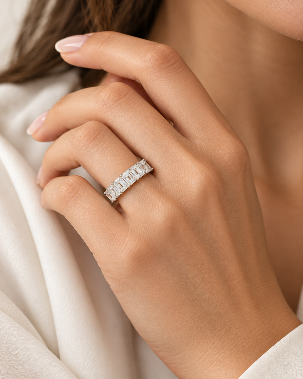 1.75ct lab-grown emerald-cut half eternity ring in 9ct white gold worn on a model hand — illustrative lifestyle image