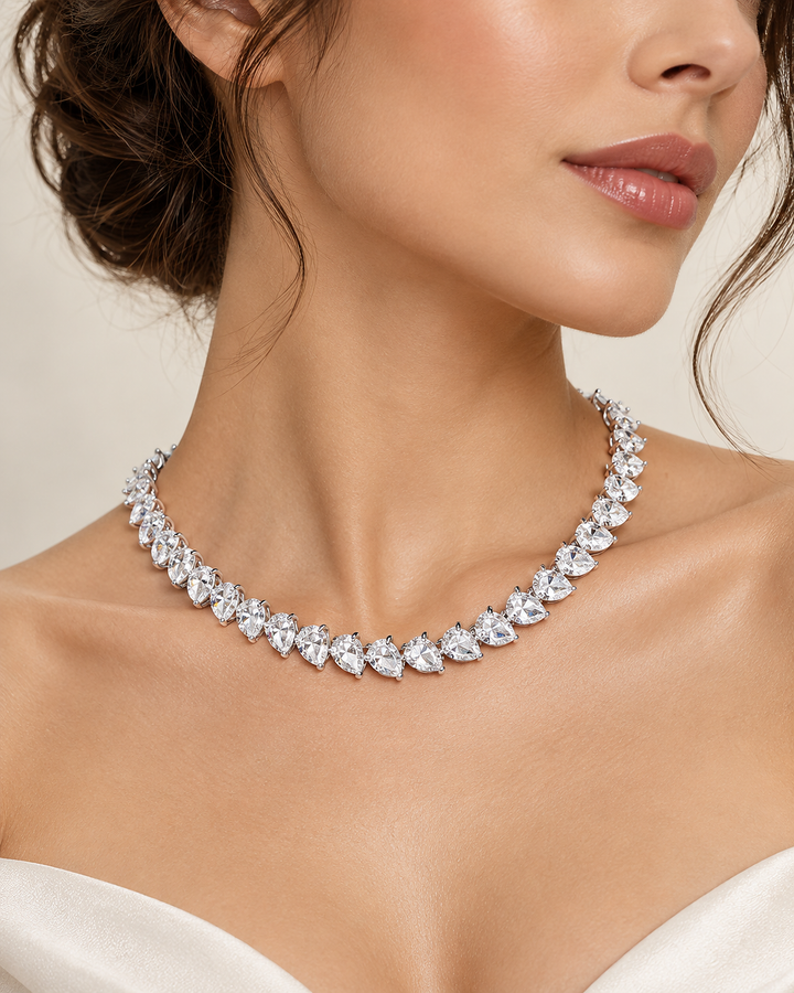 18.58ct pear-cut lab-grown diamond tennis necklace styled on model #metal_9ct-white-gold