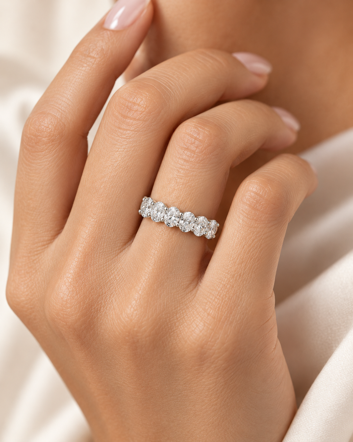 Model hand wearing GeMMs & Co platinum 2.10ct lab-grown diamond half eternity ring — illustrative lifestyle photograph