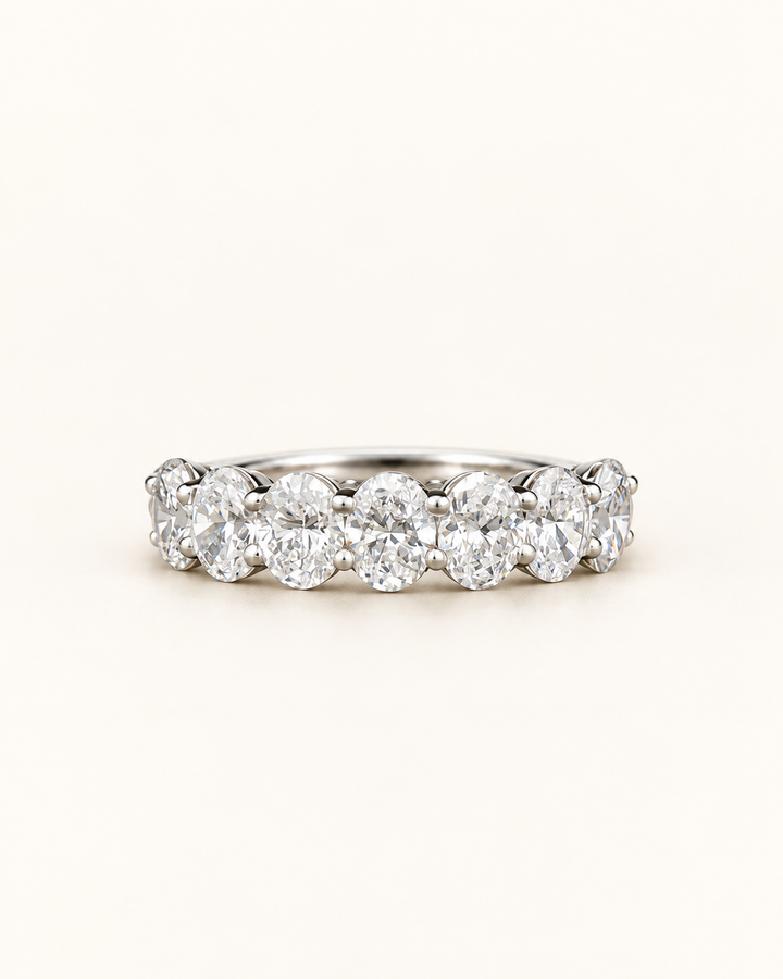 2.10ct platinum lab-grown round diamond half eternity ring on a cream background