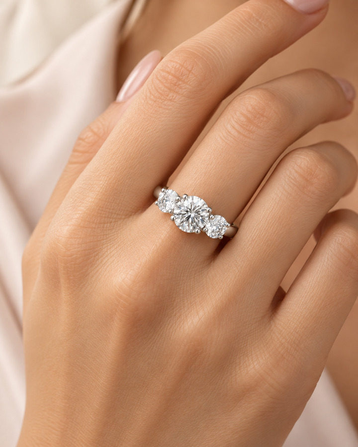 Three-stone lab-grown diamond ring in 9ct white gold on model hand — AI-styled photograph