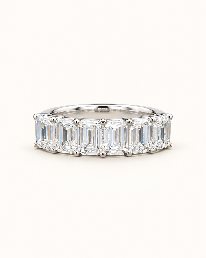 1.75ct emerald-cut lab-grown diamond half eternity ring in 9ct white gold on clean cream background — illustrative product render