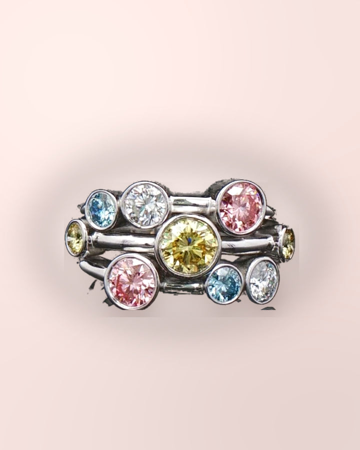 Pink styled photograph of multicoloured diamond bubble ring #metal_9ct-white-gold