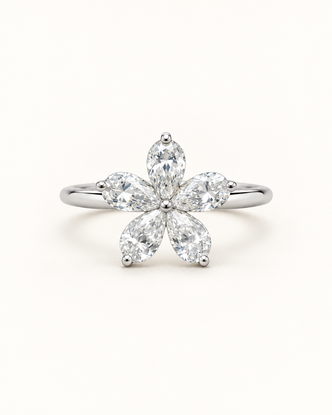 Five-petal pear-shaped lab-grown diamond flower ring in 18ct white gold on cream — illustrative product render