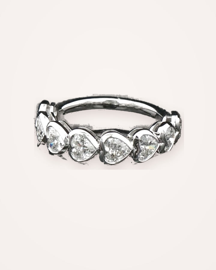 Heart-shaped diamond eternity band in white gold, clean cream background #metal_9ct-white-gold