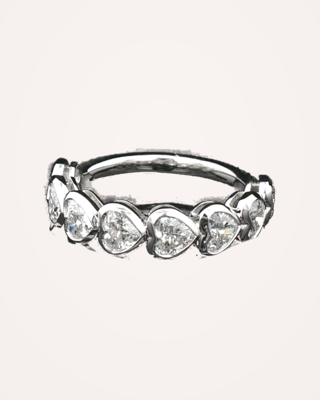 White-gold bezel-set heart diamonds close up #metal_9ct-white-gold