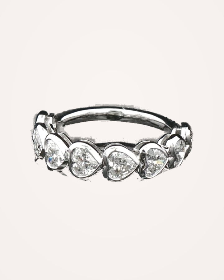 White-gold bezel-set heart diamonds close up #metal_9ct-white-gold