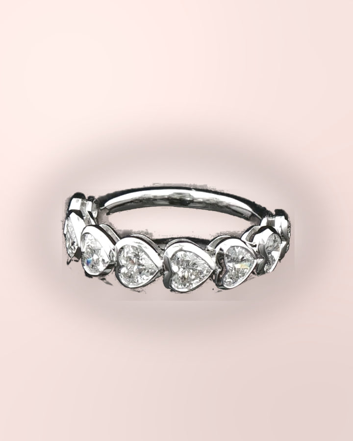 Heart-cut diamond half eternity ring in white gold on blush #metal_9ct-white-gold