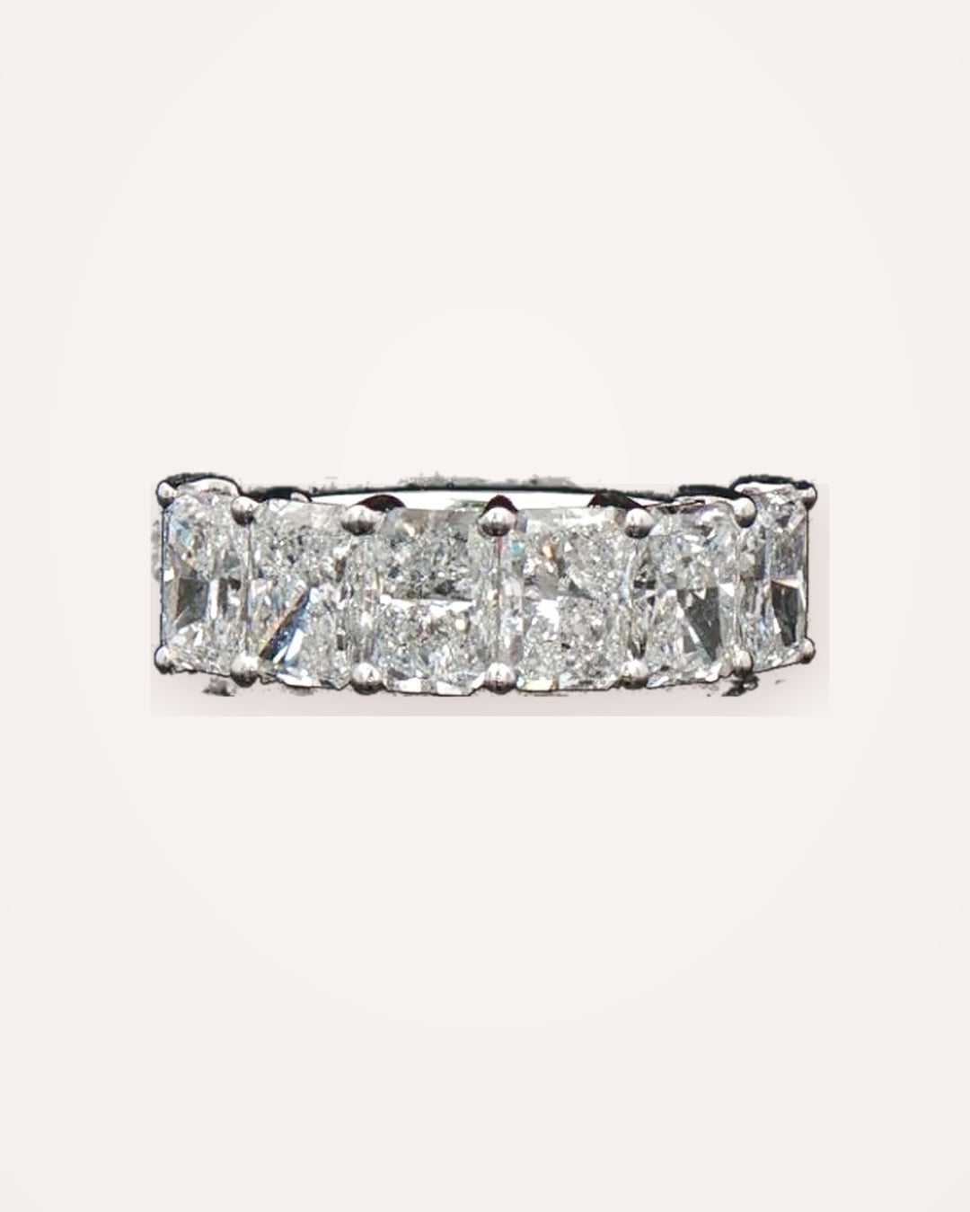 Radiant-cut lab-grown diamond eternity ring on clean cream background #metal_9ct-white-gold
