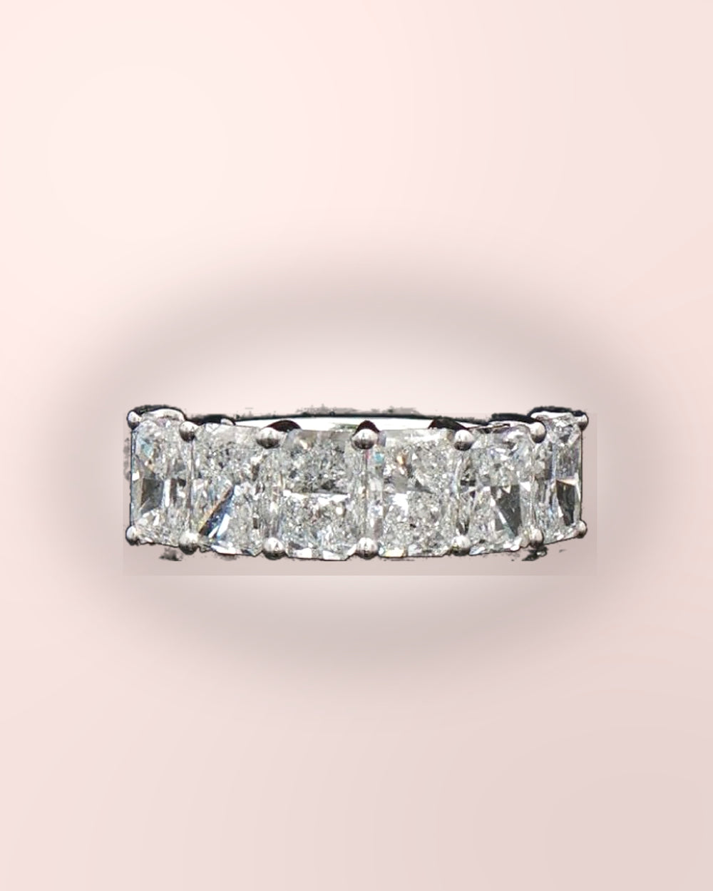 Sparkling radiant-cut diamond half eternity ring styled on blush #metal_9ct-white-gold