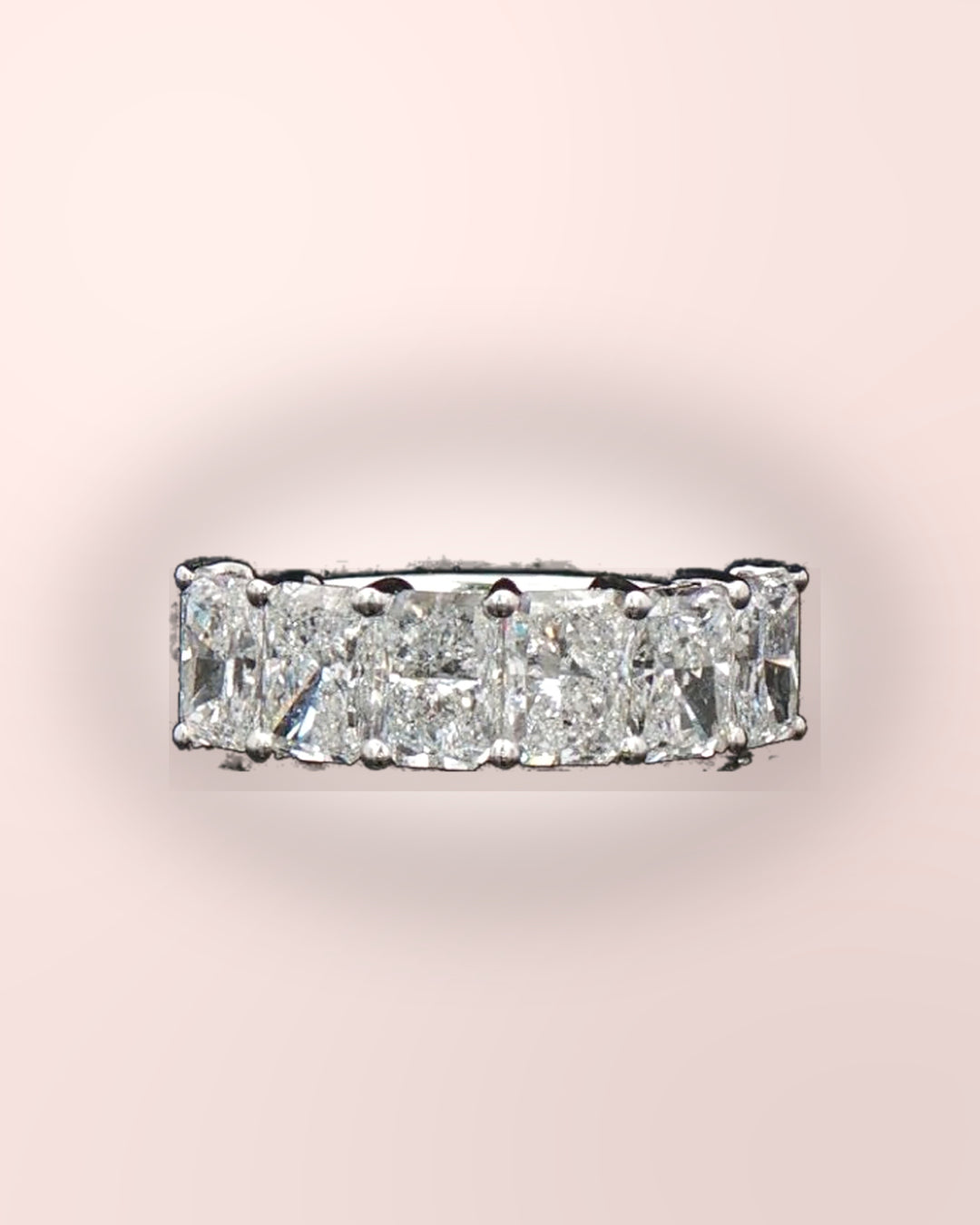 Sparkling radiant-cut diamond half eternity ring styled on blush #metal_9ct-white-gold