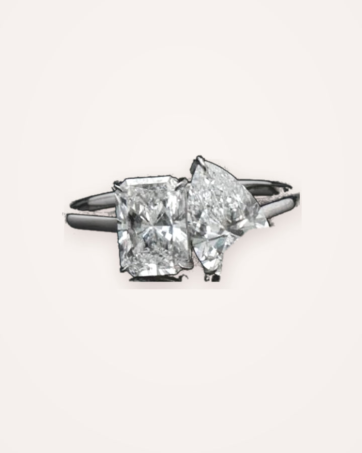 2ct radiant and pear cut Toi et Moi diamond ring on cream #metal_18ct-white-gold