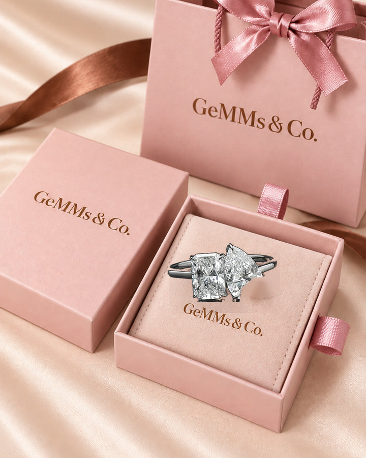 Correct Toi et Moi ring shown in GeMMs & Co pink branded jewellery box #metal_18ct-white-gold