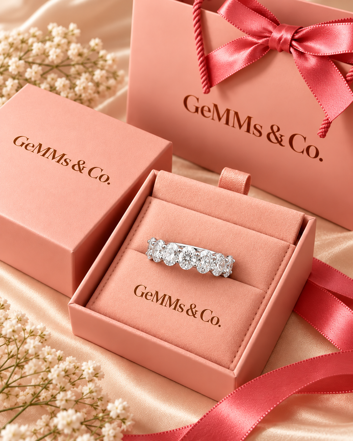 Round lab-grown diamond half eternity ring in 9ct white gold inside GeMMs & Co pink luxury gift packaging — AI-styled photograph #metal_9ct-white-gold