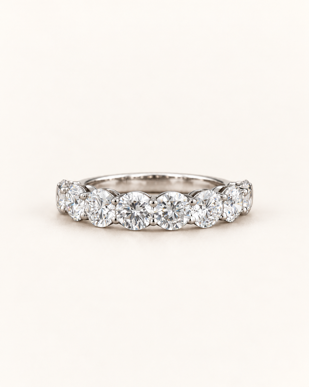 Lab-grown diamond round half eternity ring in 9ct white gold on cream, styled product image #metal_9ct-white-gold
