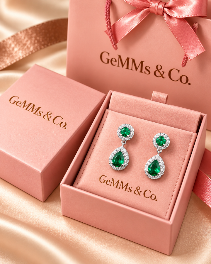 Green halo pear drop earrings — GeMMs & Co. luxury packaging portrait image