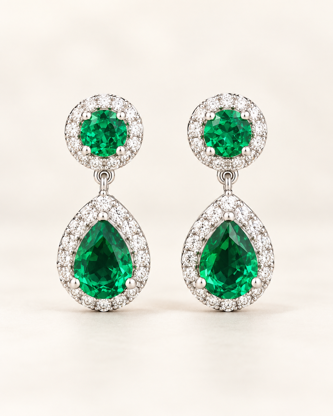 Green halo pear drop earrings — clean cream portrait product image