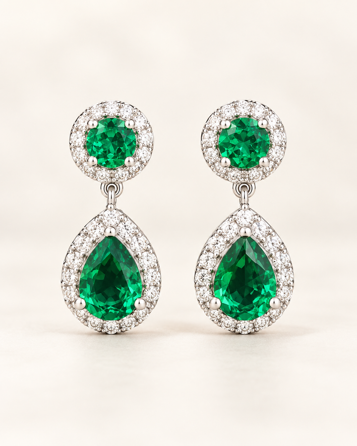 Green halo pear drop earrings — clean cream portrait product image