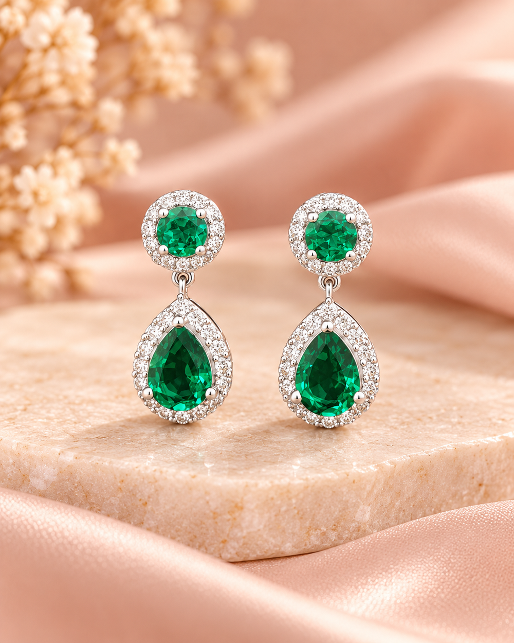 Green halo pear drop earrings — soft styled portrait image