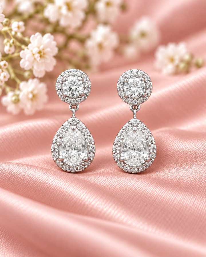 18ct white gold lab-grown diamond halo pear drop earrings — styled #metal_18ct-white-gold