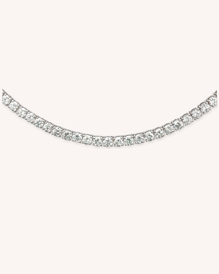 Three-Prong Lab-Grown Diamond Tennis Necklace in 18ct White Gold on cream background #metal_18ct-white-gold