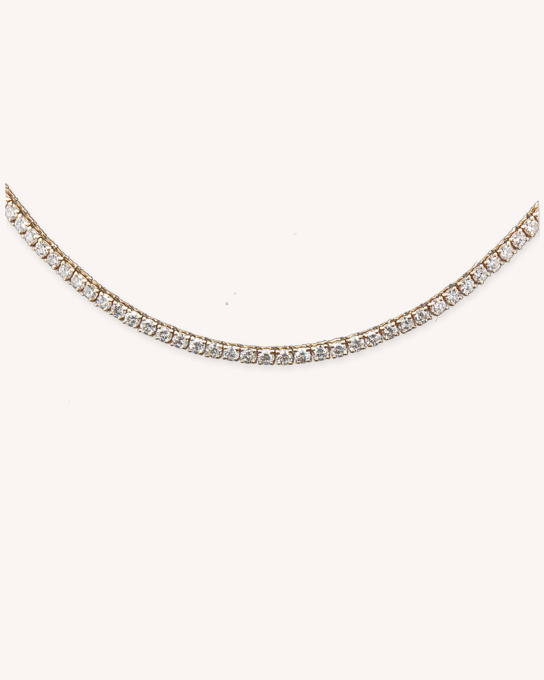 Three-Prong Lab-Grown Diamond Tennis Necklace in 18ct Yellow Gold on cream background #metal_18ct-yellow-gold