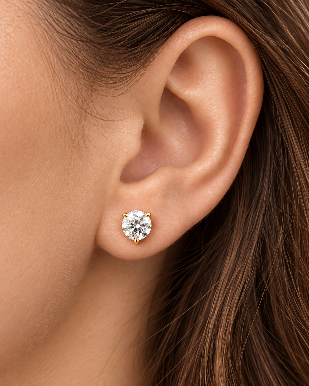 Martini lab-grown diamond stud earrings in yellow gold worn on ear #metal_9ct-yellow-gold