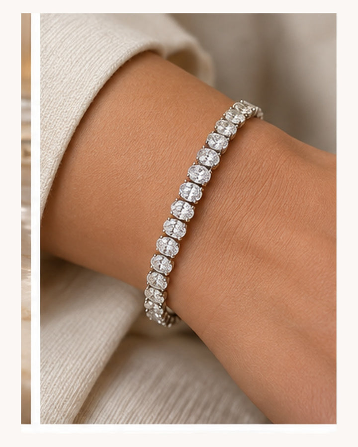 Oval cut lab-grown diamond tennis bracelet worn on wrist