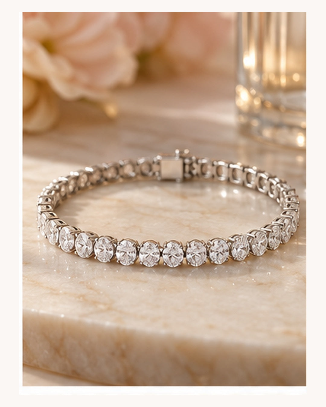 Oval cut lab-grown diamond tennis bracelet styled on a soft neutral background