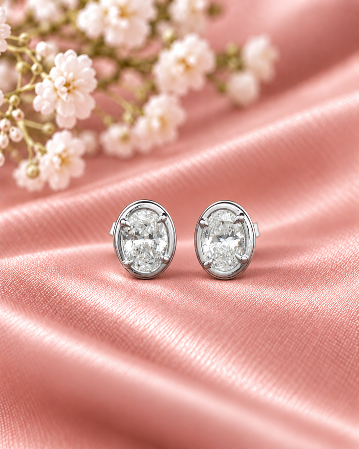 Oval-cut lab-grown diamond studs in 9ct white gold — styled #metal_9ct-white-gold