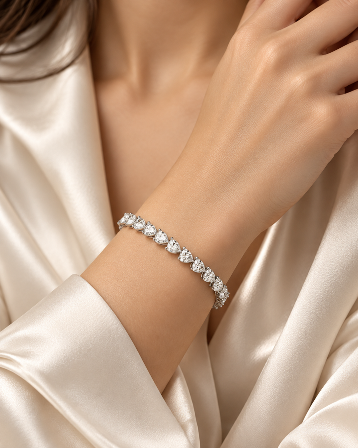 Pear shape lab-grown diamond tennis bracelet worn on wrist