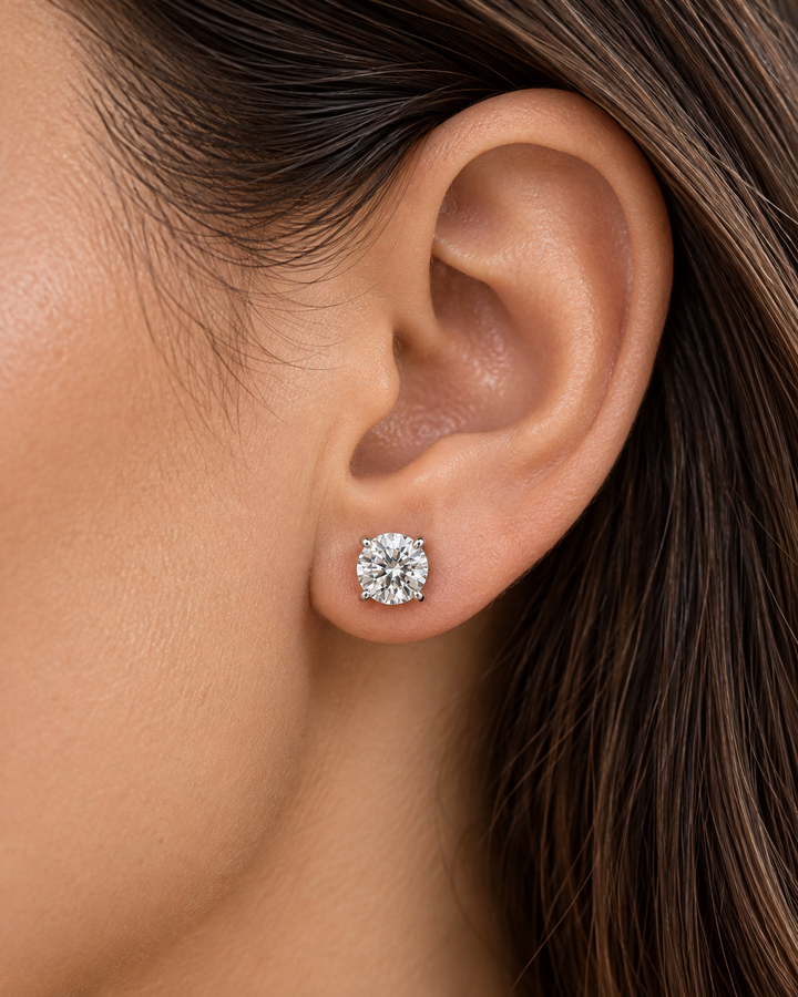IGI-certified classic lab-grown diamond stud earrings in 18ct white gold worn on ear #metal_18ct-white-gold
