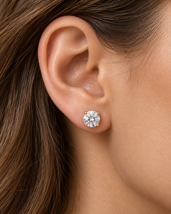 IGI-certified classic lab-grown diamond stud earrings in 9ct yellow gold worn on ear #metal_9ct-yellow-gold