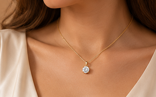 Classic solitaire pendant necklace worn on model in yellow gold #metal_yellow-gold